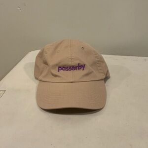 Tan cap that says Passerby on it